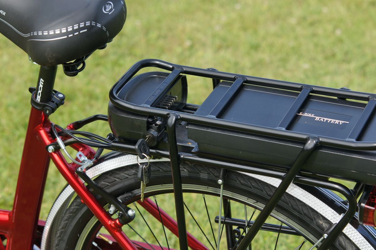 Close-up of an e-bike battery mounted on the rear rack